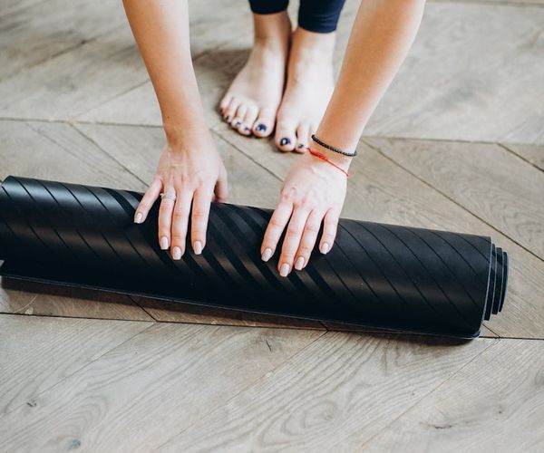 Woman stretching gently, embodying flexibility and well-being.